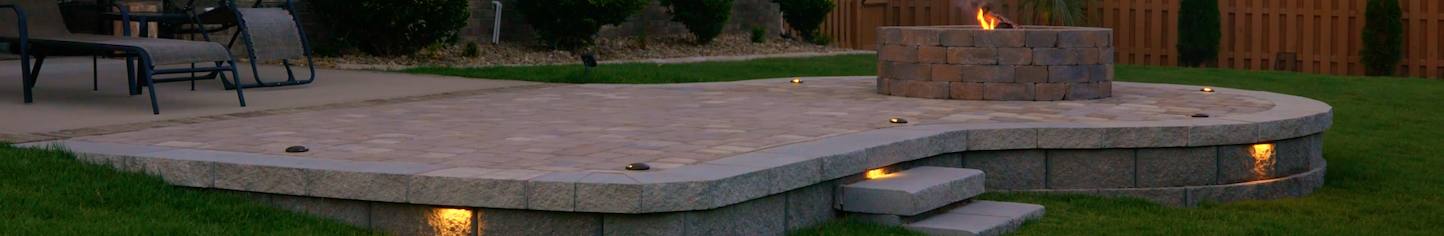 Curved patio with built-in seating under construction